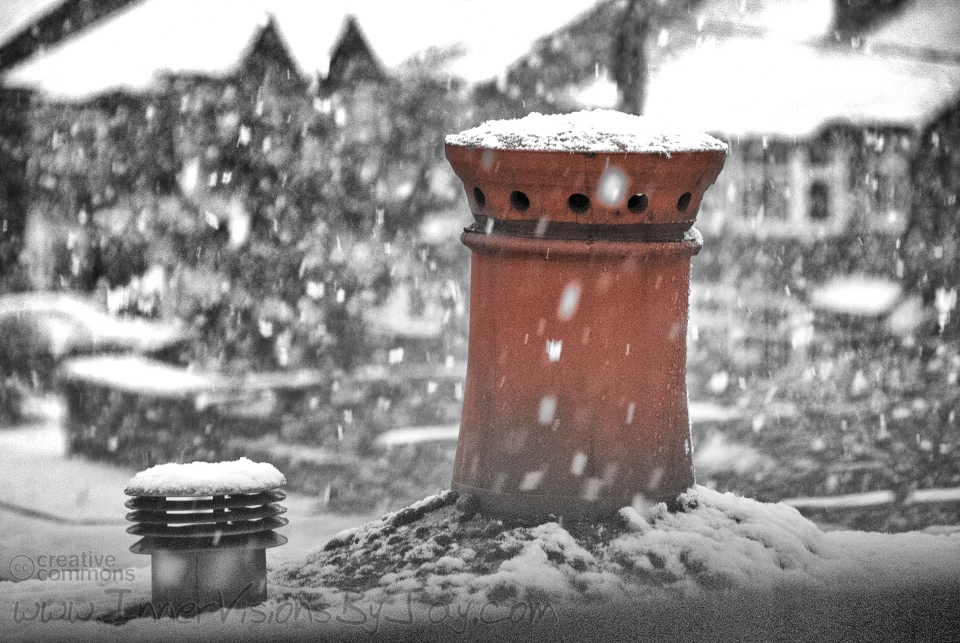 Snowy red chimney vent